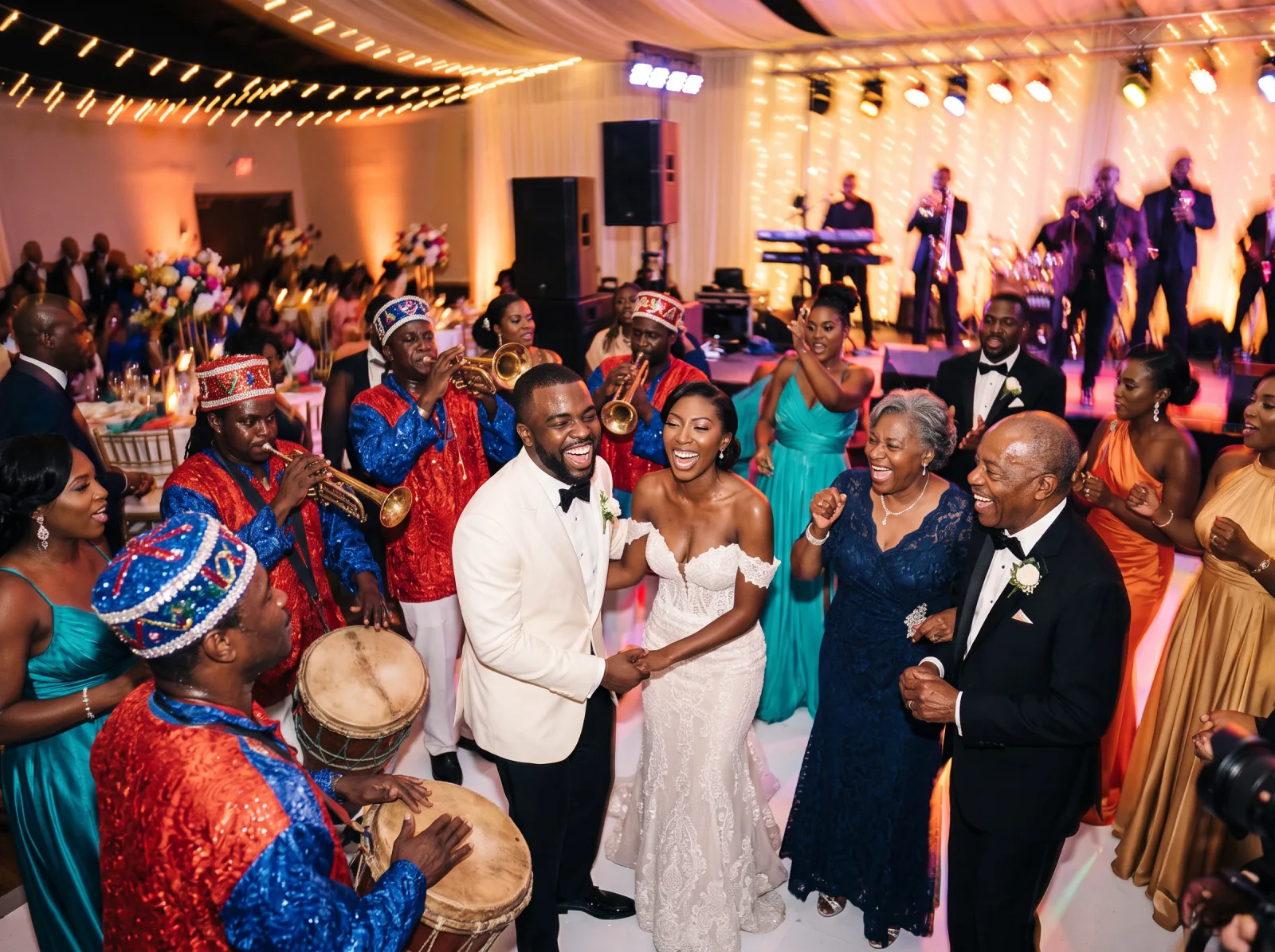 Rara musicians in red and blue sequinned costumes playing horns and tanbou drums while the couple dance with older family members at a Haitian wedding reception